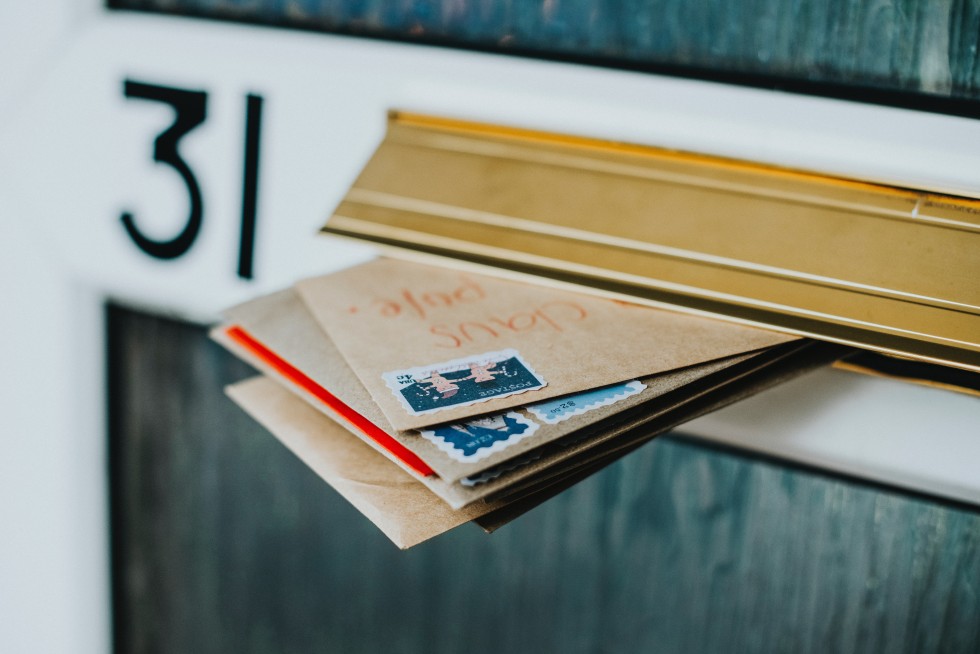 letters sticking out of a letterbox