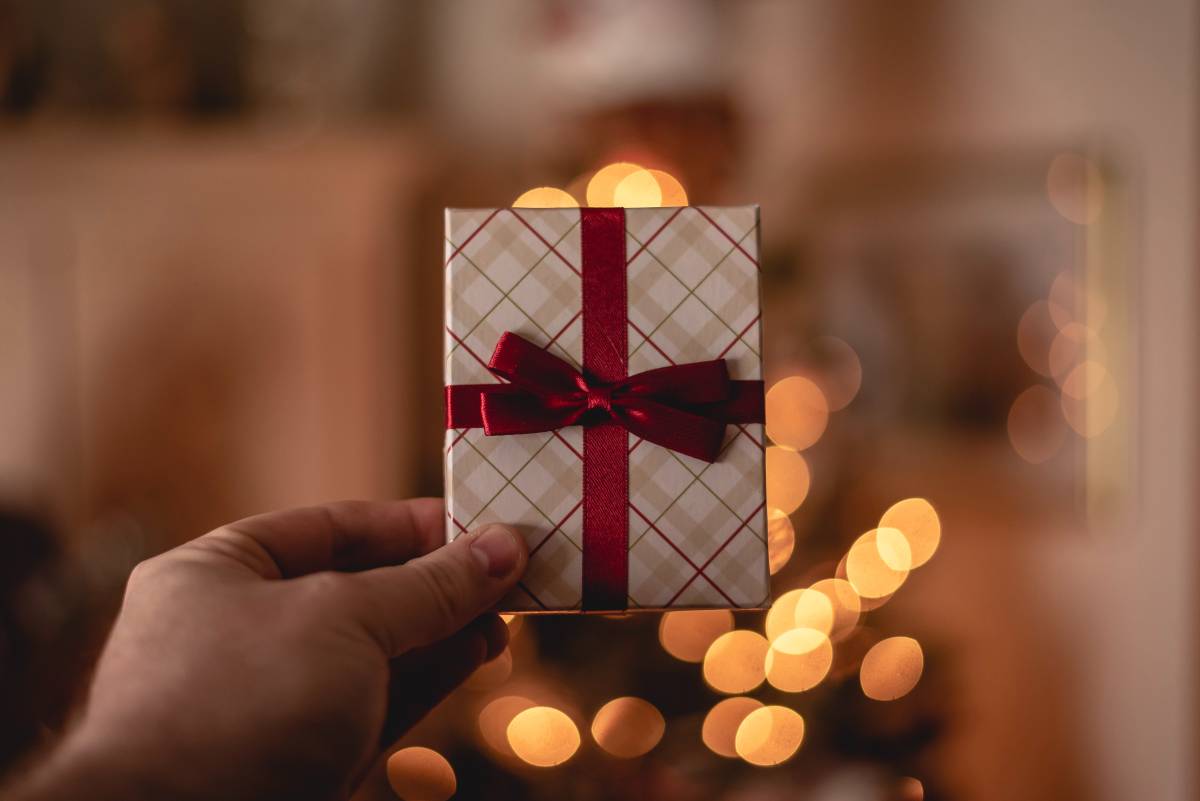 person holding up a gift card